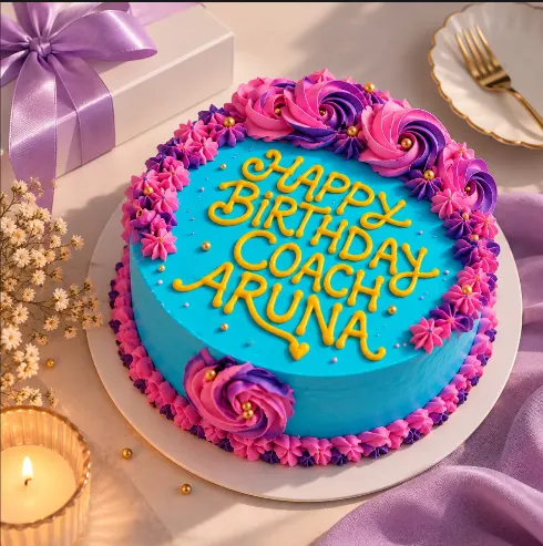 Turquoise birthday cake with magenta and violet rosettes and a name piped in golden yellow
